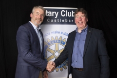 Outgoing President Paul Kilcourse congratulates Willie Geraghty