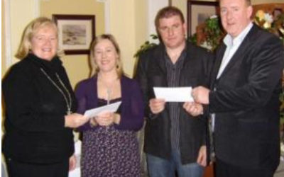 Dolores Burke and Pat Gallagher present a €3,000 cheque to Mayo Autism