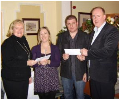 Dolores Burke and Pat Gallagher present a €3,000 cheque to Mayo Autism