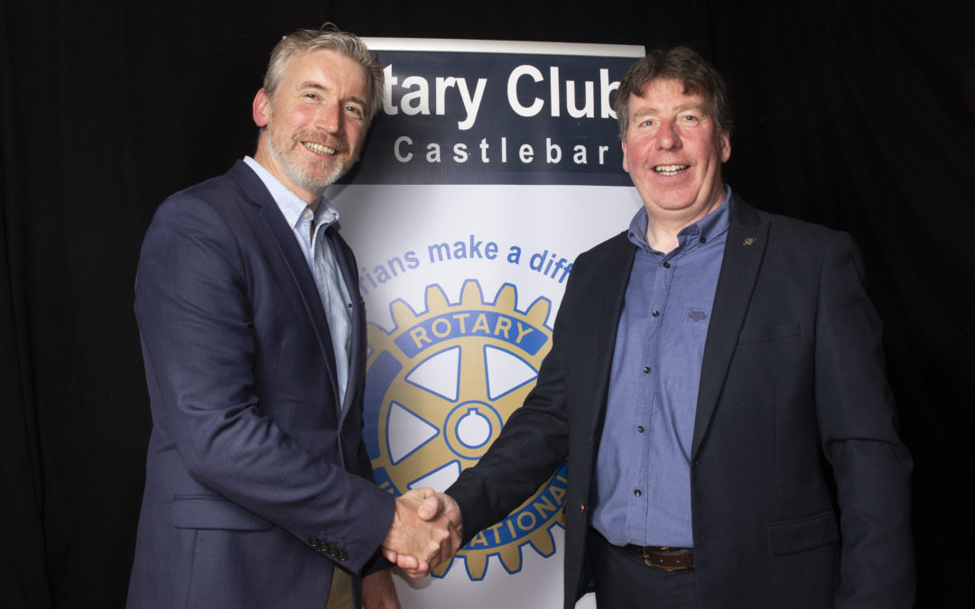 Outgoing Club President Paul Kilcourse hands over to Willie Geraghty